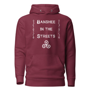 unisex maroon hoodie, with image phrase "Banshee in the Streets," with image symbol Triskelion. Front View.