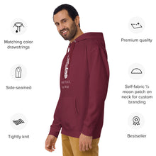 Load image into Gallery viewer, man modeling/wearing maroon unisex hoodie, with pockets, with image phrase &quot;Make peace, not war.&quot; with image graphic of a skeleton hand holding a daisy flower, and gesturing the peace sign. Front view.
