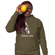 Load image into Gallery viewer, Woman modeling/wearing military army green unisex hoodie, with pockets. Image design: silhouette of a pretty witch holding a magical broom, stars. Image phrase: Broomstick rebel. Front view.
