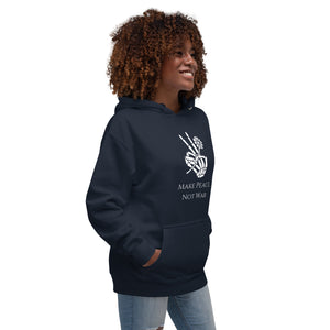 Woman modeling/wearing navy blue unisex hoodie, with pockets, with image phrase "Make peace, not war." with image graphic of a skeleton hand holding a daisy flower, and gesturing the peace sign. Front view.