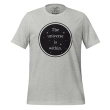 Load image into Gallery viewer, unisex heather grey t-shirt, with image phrase &quot;The universe is within,&quot; enclosed in a black circle and stars.
