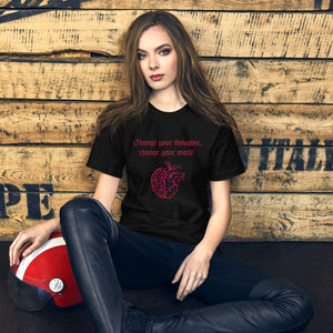 woman modeling/wearing unisex black t-shirt, with image design: red half brain, half heart. Image phrase: Red text - Change your thoughts, change your world. Front view.