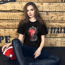 Load image into Gallery viewer, unisex black t-shirt, with image design of an angel kissing a woman, with a red paint splat seen through their outlines. Front view.
