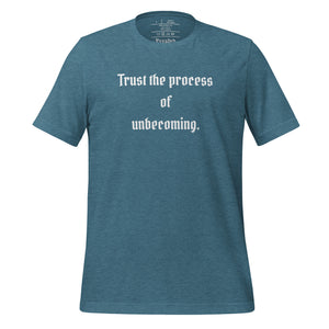 unisex heather deep teal t-shirt, with image phrase: "Trust the process of unbecoming" Front view.