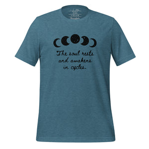 unisex heather deep teal t-shirt, with image of black celestial moon phases, with star cut outs, and image phrase "The soul rests and awakens in cycles." Front view.