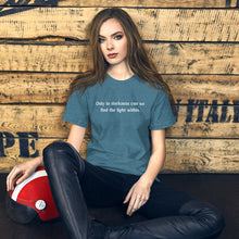 Load image into Gallery viewer, woman modeling/wearing unisex heather deep teal t-shirt, with image phrase: &quot;only in darkness can we find the light within.&quot; Front view.
