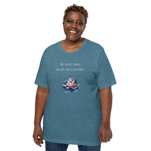 woman modeling/wearing unisex heather deep teal t-shirt, with image phrase: "The quiet mind hears the Universe." Image of watercolor pink and blue lotus flower floating on water.