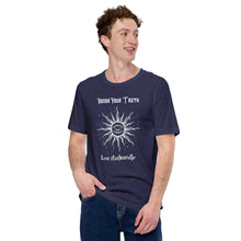 Load image into Gallery viewer, Man modeling/wearing Unisex heather midnight navy blue t-shirt with Image Design: Text &quot;Honor your truth, Live authentically,&quot; with center image of sun, eye in center of sun, moon in the eye&#39;s iris, stars all around.
