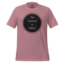 Load image into Gallery viewer, unisex heather orchid pink t-shirt, with image phrase &quot;The universe is within,&quot; enclosed in a black circle and stars.
