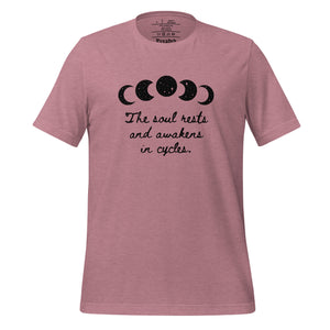 unisex heather orchid pink t-shirt, with image of black celestial moon phases, with star cut outs, and image phrase "The soul rests and awakens in cycles." Front view.