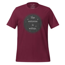 Load image into Gallery viewer, unisex maroon t-shirt, with image phrase &quot;The universe is within,&quot; enclosed in a black circle and stars.
