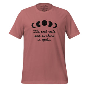 unisex mauve t-shirt, with image of black celestial moon phases, with star cut outs, and image phrase "The soul rests and awakens in cycles." Front view.