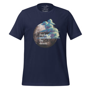 unisex navy blue t-shirt with image design of a dark moon, with a colorful dawn cloud in front, with image phrase: "Darkness precedes the Dawn." Front View.