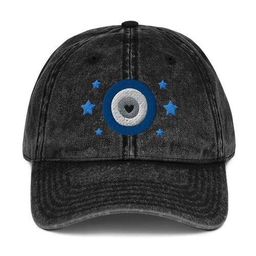 vintage denim cap black, with image design of blue eye of protection/evil eye/third eye, with stars. Front view.