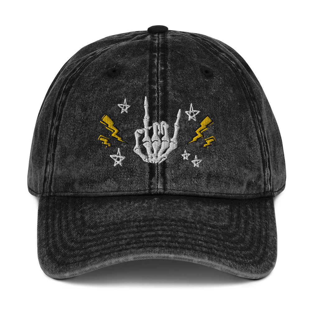 vintage denim cap black, with image design of rock on skeleton hand, pentagram stars, lightning symbols. 