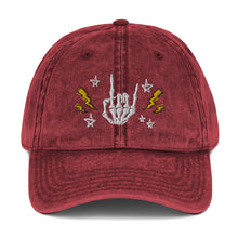 Load image into Gallery viewer, vintage denim cap maroon, with image design of rock on skeleton hand, pentagram stars, lightning symbols. 
