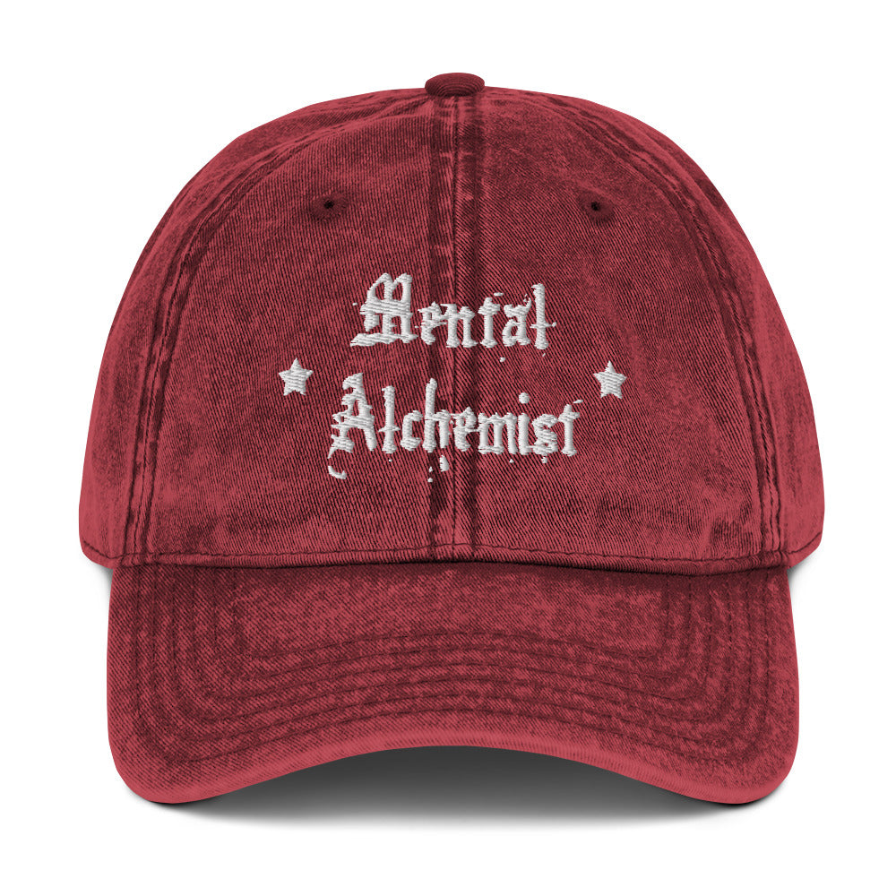 vintage denim cap maroon, with image phrase: "Mental Alchemist." Front view.