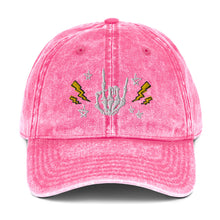 Load image into Gallery viewer, vintage denim cap pink, with image design of rock on skeleton hand, pentagram stars, lightning symbols. 
