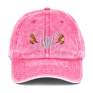 vintage denim cap pink, with image design of rock on skeleton hand, pentagram stars, lightning symbols. 