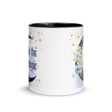 Load image into Gallery viewer, 11 oz. white ceramic coffee/tea mug with solid black handle, rim, and inside. Image Design: watercolor blue crescent moon, with flowers, daisies, lilies, butterflies. Stars in background, smoky purple background. Image phrase: Be the Magic. Center front view. Halloween, spooky season.
