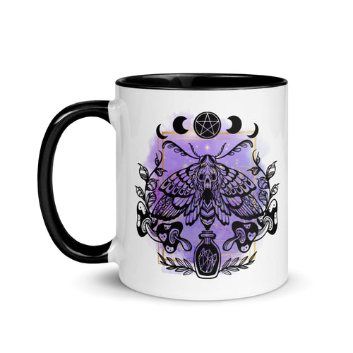 11 oz. white ceramic coffee/tea mug with solid black handle, rim, and inside. Design: Moth with a skull, moon phases, pentacle, mushrooms, and a crystal vial. left hand side view.