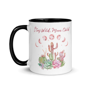 11 oz. white ceramic coffee/tea mug with solid black handle, rim, and inside. Image Design: Moon phases, colorful pink and green tinged cacti, with "Stay Wild Moon Child" text. Left hand side view.