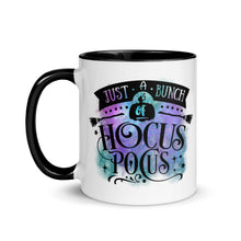 Load image into Gallery viewer, 11 oz. white ceramic coffee/tea mug with solid black handle, rim, and inside. Image Design: phrase &quot;just a bunch of Hocus Pocus, with mini image of pumpkin and broom,  whimsical font. backed by blue and purple cosmic cloud. Image phrase: Just a bunch of Hocus Pocus. Left hand side view. Halloween, spooky season.
