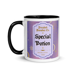 11 oz. white ceramic coffee/tea mug with solid black handle, rim, and inside. Image Design: potion label that says 'Special Potion' with brand name above 'Dreaded Banshee Co., established 1690.' Purple-bluish background color with motif of suns, crescent moons, stars, constellations. Image phrase: Special Potion. Left hand side view. Halloween, spooky season.