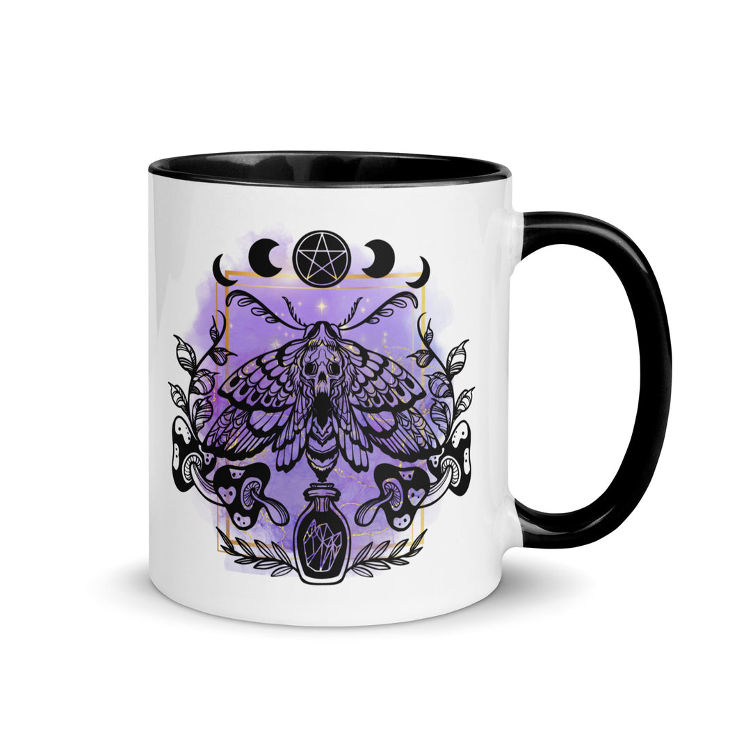 11 oz. white ceramic coffee/tea mug with solid black handle, rim, and inside. Design: Moth with a skull, moon phases, pentacle, mushrooms, and a crystal vial. right hand side view.