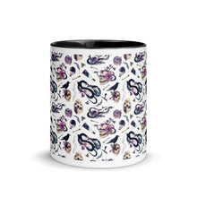 Load image into Gallery viewer, 11 oz. white ceramic coffee/tea mug with solid black handle, rim, and inside. Image Design: gothic theme patter of skulls, wands, snakes, ravens, purple flowers. Center front view. 
Halloween, spooky season.
