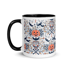 Load image into Gallery viewer, 11 oz. white ceramic coffee/tea mug with solid black handle, rim, and inside. Image Design: Halloween pattern of skull faces, crossbones, bats, pumpkins, fall leaves. left hand side view.
