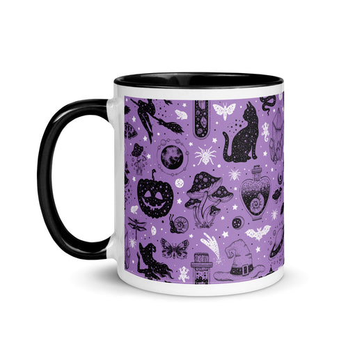 11 oz. white ceramic coffee/tea mug with solid black handle, rim, and inside. Image Design: Halloween theme pattern of witch on broom, pumpkins, spiders, cats, potion bottles, snails, bats, mushrooms, with a cosmic tone. Purple background color. left hand side view. Halloween, spooky season.