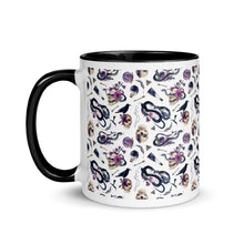 Load image into Gallery viewer, 11 oz. white ceramic coffee/tea mug with solid black handle, rim, and inside. Image Design: gothic theme patter of skulls, wands, snakes, ravens, purple flowers. left hand side view. 
Halloween, spooky season.
