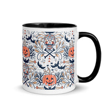 Load image into Gallery viewer, 11 oz. white ceramic coffee/tea mug with solid black handle, rim, and inside. Image Design: Halloween pattern of skull faces, crossbones, bats, pumpkins, fall leaves. right hand side view.
