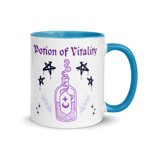 11 oz. white ceramic coffee/tea mug with solid light blue handle, rim, and inside. Image Design:  purple minimalist potion bottle with a label, moon and star on label, surrounded by graffiti pentacle stars. Image phrase: Potion of Vitality. Right hand side view. Halloween, spooky season.