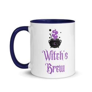 11 oz. white ceramic coffee/tea mug with solid navy blue handle, rim, and inside. Image Design: above image phrase, black cauldron with purple smoke, crescent moon on cauldron. Image phrase: Witch's brew. Left hand side view. Halloween, spooky season.