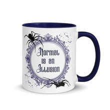 Load image into Gallery viewer, 11 oz. white ceramic coffee/tea mug with solid navy blue handle, rim, and inside. Image Design: Words &#39;Normal is an Illusion&#39; in a elegant border, with spider silhouettes, and stars. Image phrase: Normal is an Illusion. Right hand side view. Halloween, spooky season.
