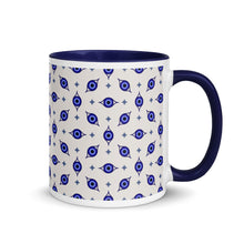 Load image into Gallery viewer, 11 oz. white ceramic coffee/tea mug with solid navy blue handle, rim, and inside. Wrapped around mug is patterned image of eye of protection/evil eye. Right hand side view.
