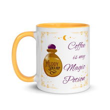 Load image into Gallery viewer, 11 oz. white ceramic coffee/tea mug with solid golden yellow handle, rim, and inside. Image Design: golden potion bottle that says muddy swamp, golden border with gold stars, and moon crescent. Image phrase: Coffee is my Magic Potion. Left hand side view. Halloween, spooky season.
