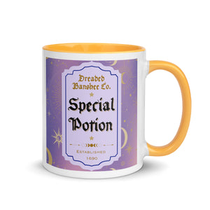 11 oz. white ceramic coffee/tea mug with solid golden yellow handle, rim, and inside. Image Design: potion label that says 'Special Potion' with brand name above 'Dreaded Banshee Co., established 1690.' Purple-bluish background color with motif of suns, crescent moons, stars, constellations. Image phrase: Special Potion. Right hand side view. Halloween, spooky season.