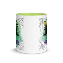 Load image into Gallery viewer, 11 oz. white ceramic coffee/tea mug with solid light green handle, rim, and inside. Image Design: a silhouette of a haunted house, with a moon behind it, and cosmic green cloud behind image. Spider webs in each corners of image. Image phrase: I&#39;m a Haunt Mess. Center front view. Halloween, spooky season.
