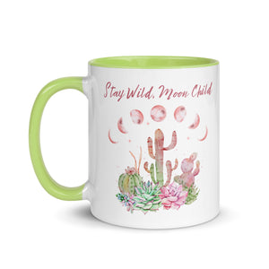 11 oz. white ceramic coffee/tea mug with solid light green handle, rim, and inside. Image Design: Moon phases, colorful pink and green tinged cacti, with "Stay Wild Moon Child" text. Left hand side view.