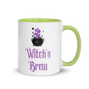 11 oz. white ceramic coffee/tea mug with solid light green handle, rim, and inside. Image Design: above image phrase, black cauldron with purple smoke, crescent moon on cauldron. Image phrase: Witch's brew. Right hand side view. Halloween, spooky season.