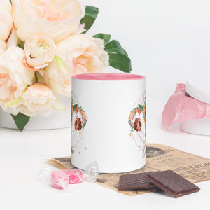 11 oz. white ceramic coffee/tea mug with solid light pink handle, rim, and inside. Image Design: Female reproductive organ, vagina, uterus, ovaries, with leaves and flowers, moon phases above. Outside center  view.