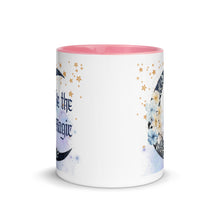 Load image into Gallery viewer, 11 oz. white ceramic coffee/tea mug with solid light pink handle, rim, and inside. Image Design: watercolor blue crescent moon, with flowers, daisies, lilies, butterflies. Stars in background, smoky purple background. Image phrase: Be the Magic. Center front view. Halloween, spooky season.
