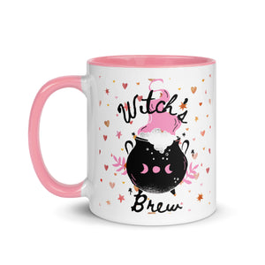 11 oz. white ceramic coffee/tea mug with solid light pink handle, rim, and inside. Image Design: cute whimsical cauldron with moon phase on cauldron, in the background are hearts, stars. Image phrase: Witch's brew. Left hand side view. Halloween, spooky season.