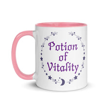 Load image into Gallery viewer, 11 oz. white ceramic coffee/tea mug with solid light pink handle, rim, and inside. Image Design: Purple words &#39;Potion of Vitality&#39; bordered by stars, leaves, and crescent moon at the bottom. Image phrase: Potion of Vitality. Left hand side view. Halloween, spooky season.
