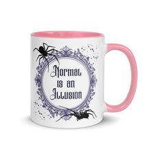 Load image into Gallery viewer, 11 oz. white ceramic coffee/tea mug with solid light pink handle, rim, and inside. Image Design: Words &#39;Normal is an Illusion&#39; in a elegant border, with spider silhouettes, and stars. Image phrase: Normal is an Illusion. Right hand side view. Halloween, spooky season.
