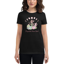 Load image into Gallery viewer, woman modeling/wearing women&#39;s black t-shirt with image design of Moon phases, cacti and flowers, and &quot;Stay Wild Moon Child&quot; text
