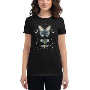 woman modeling/wearing women's black t-shirt. Image Design: boho chic style teal blue and light yellow illustrated butterfly, moth, and beetle with celestial elements, stars, moon crescents.